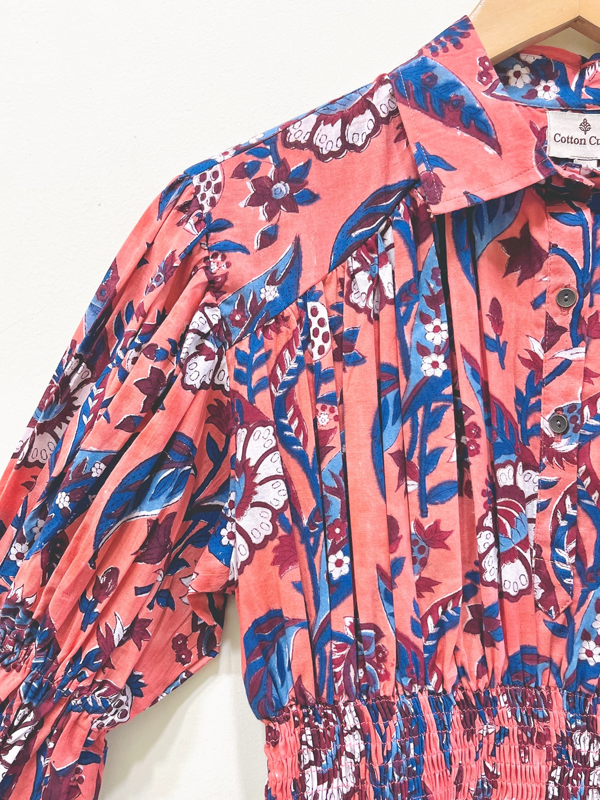 Coral Garden Smocked Peplum Top