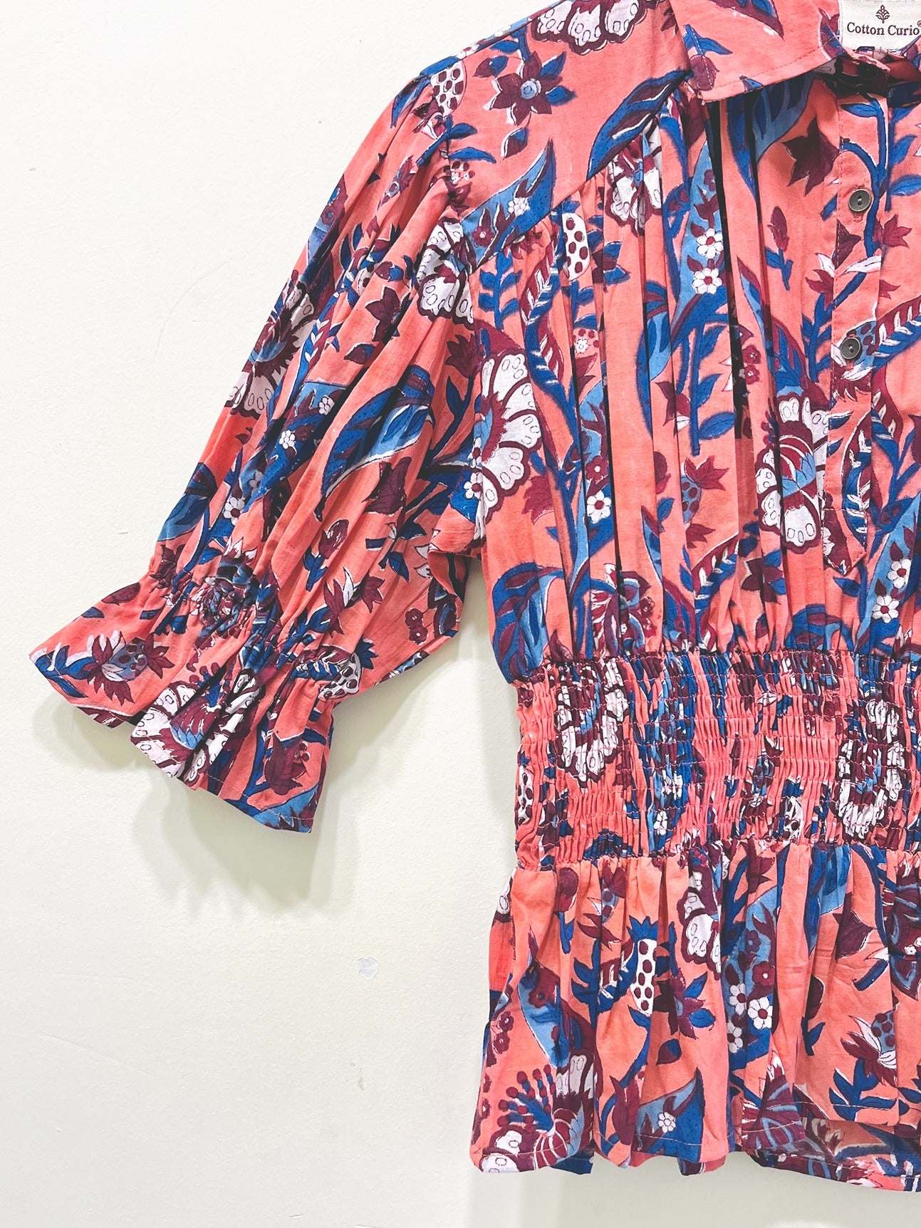 Coral Garden Smocked Peplum Top
